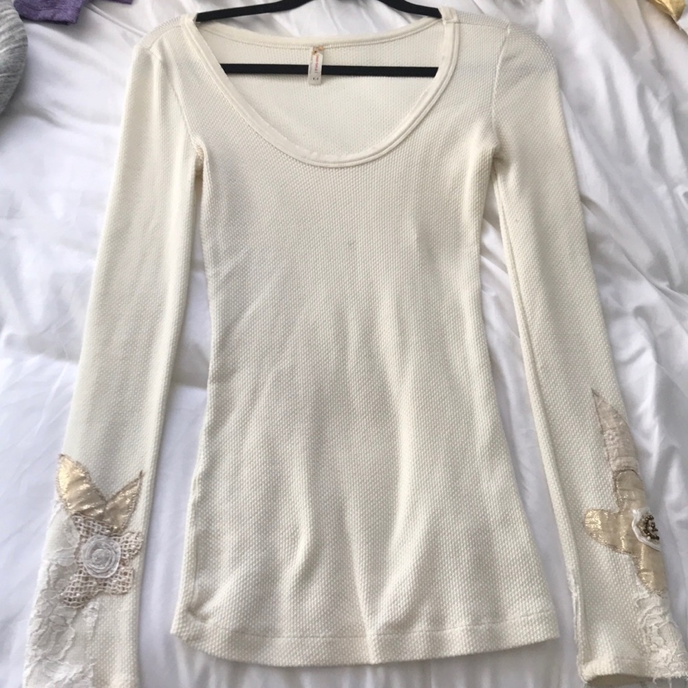 cream colored long sleeve shirt